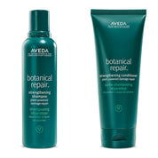 Aveda botanical repair shampoo and conditioner on a white background