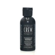 Black bottle of American Crew shaving cream on a white background