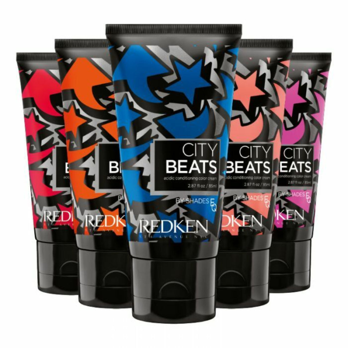 Multiple tubes of Redken City Beats hair color on a white background