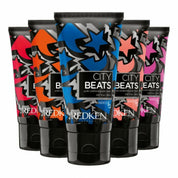 Multiple tubes of Redken City Beats hair color on a white background
